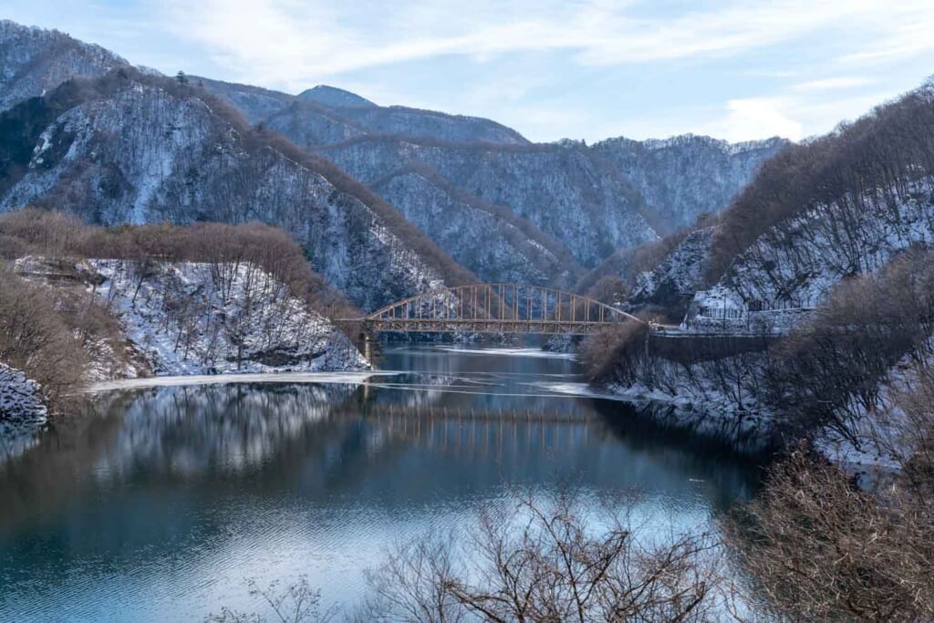 bridge over river between mountains in winter Nikko