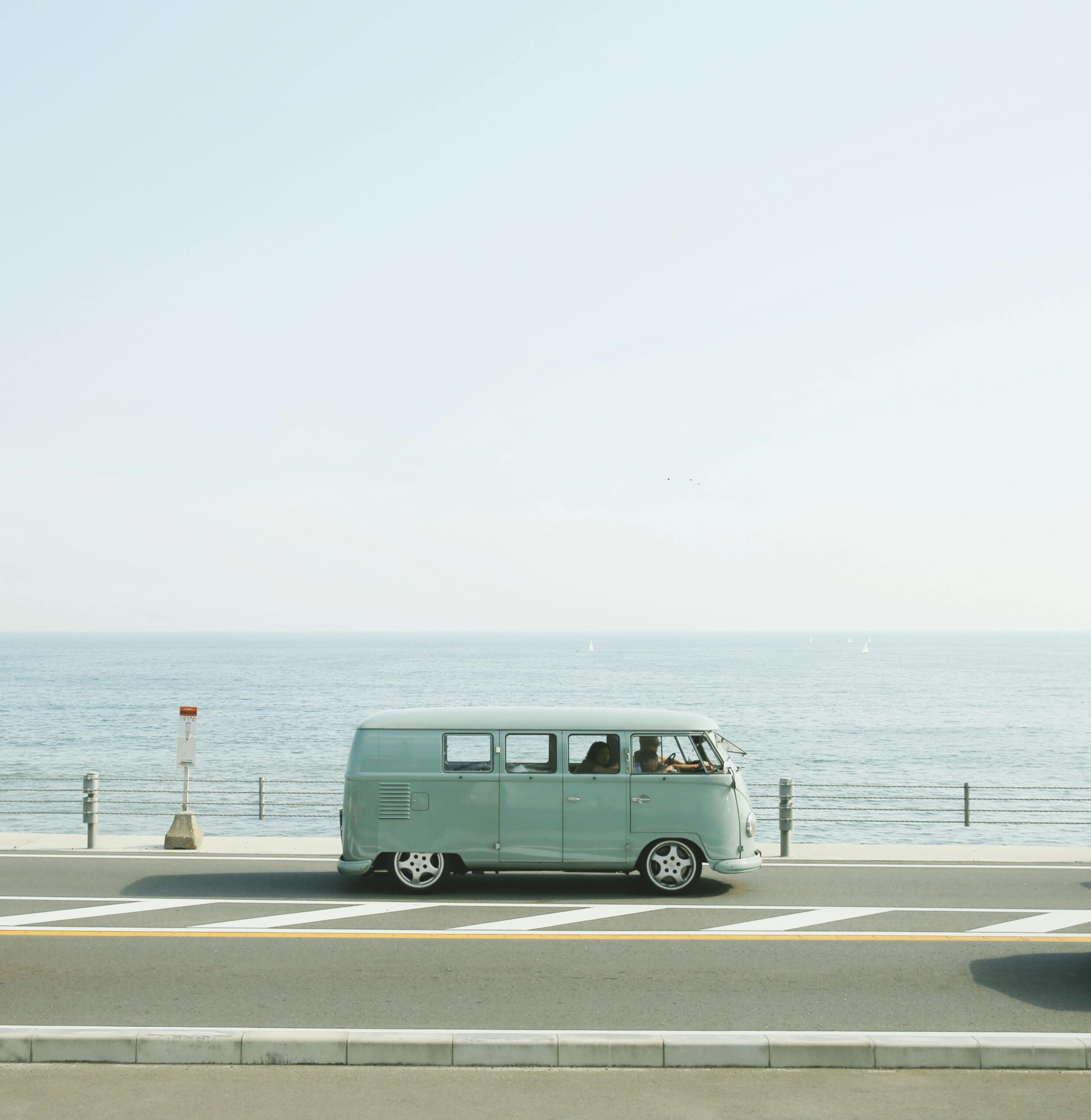 A camper van in front of the sea