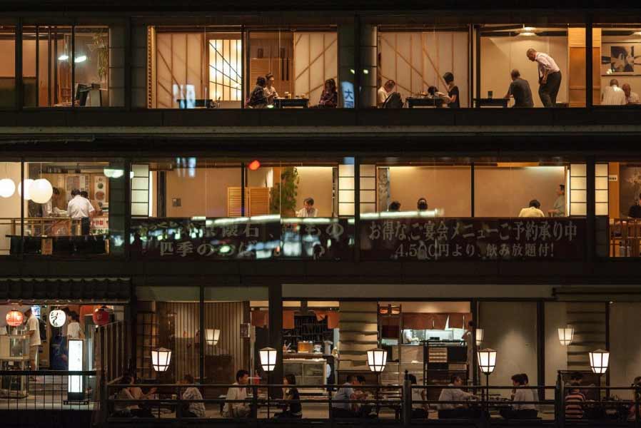 Diners in three story restaurant buildingin Japan