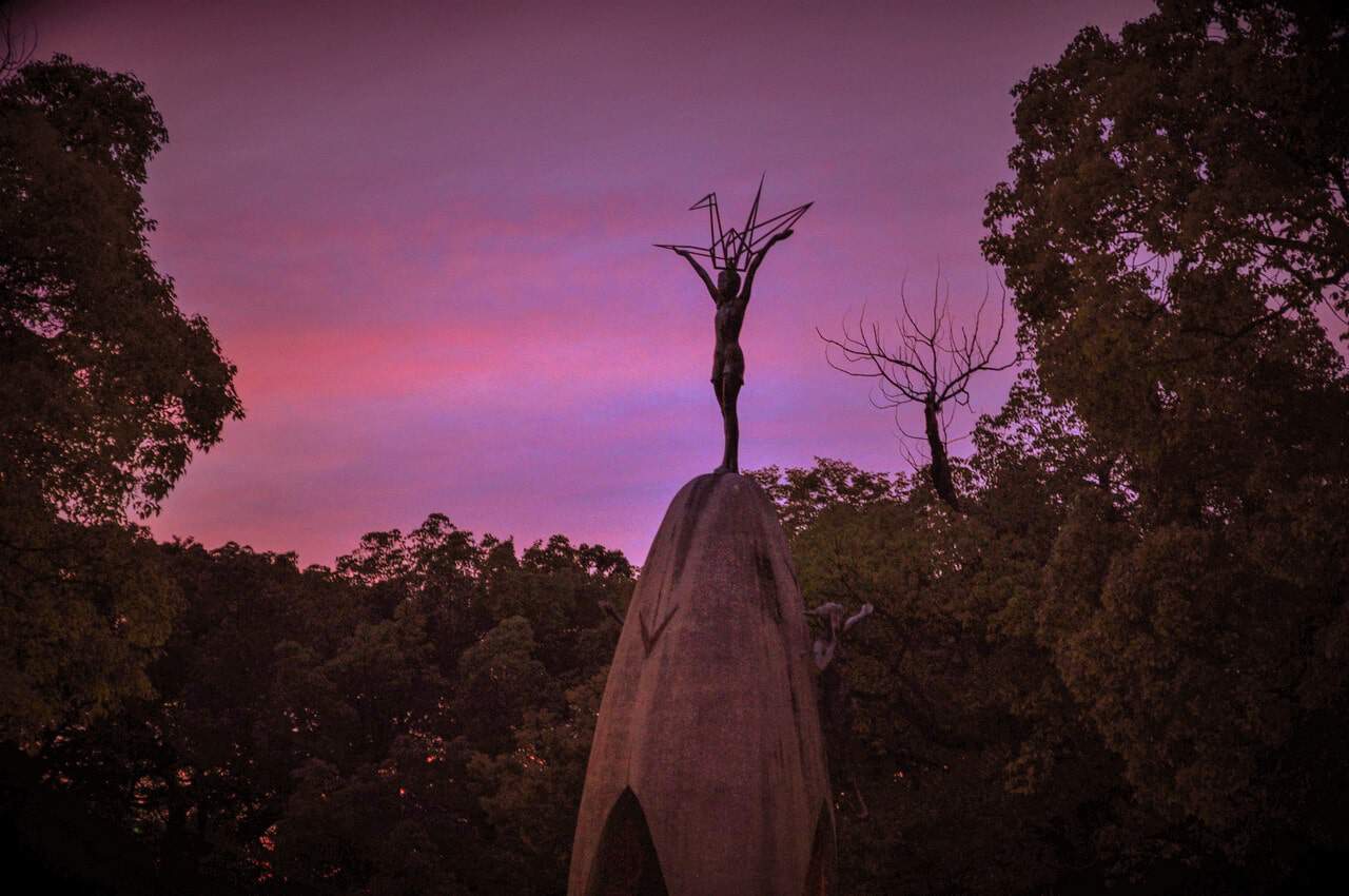 Sasaki Sadako statue with a purple sunset in Hiroshima Japan
