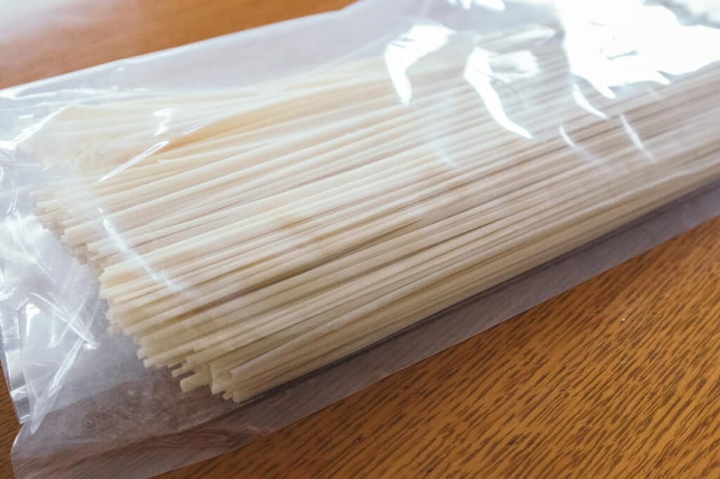 a bag of freshly made udon in japan