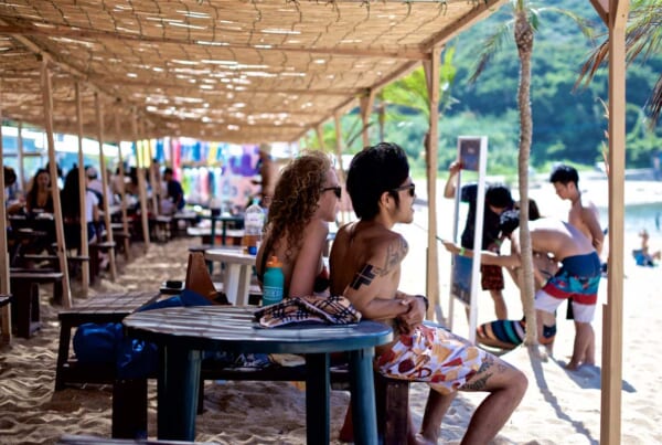 A Japanese boy with tattoos in the beach