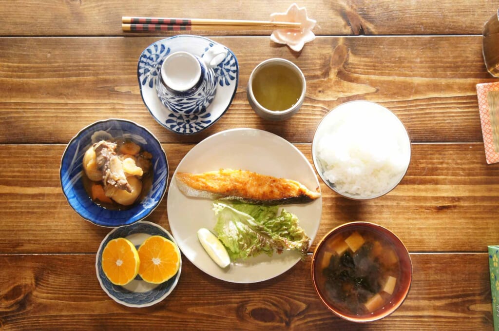 Japanese traditional breakfast with salmon, rice and miso soup served in a Farmers' stay in Kunisaki, Oita