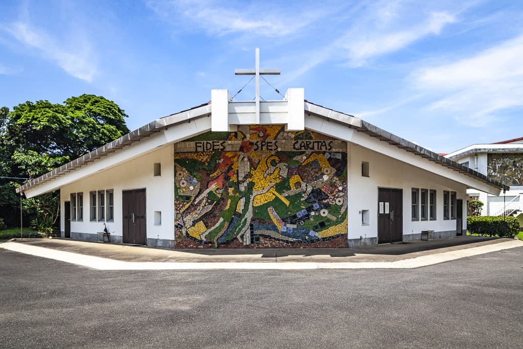 exterior of Miiraku Catholic Church with glass mosaic