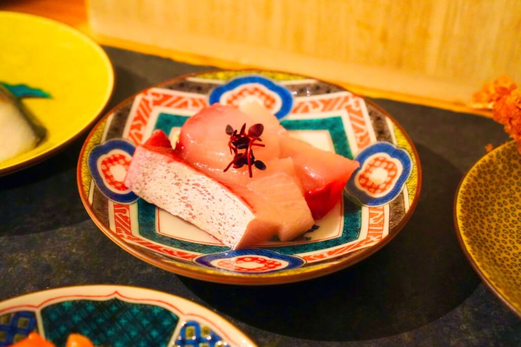 Pink sashimi served in Ishikawa on a Kutani ware plate