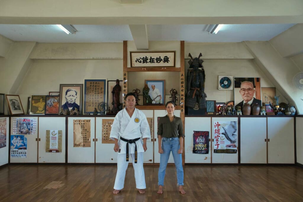 man and woman standing in a karate dojo in Okinawa, Japan