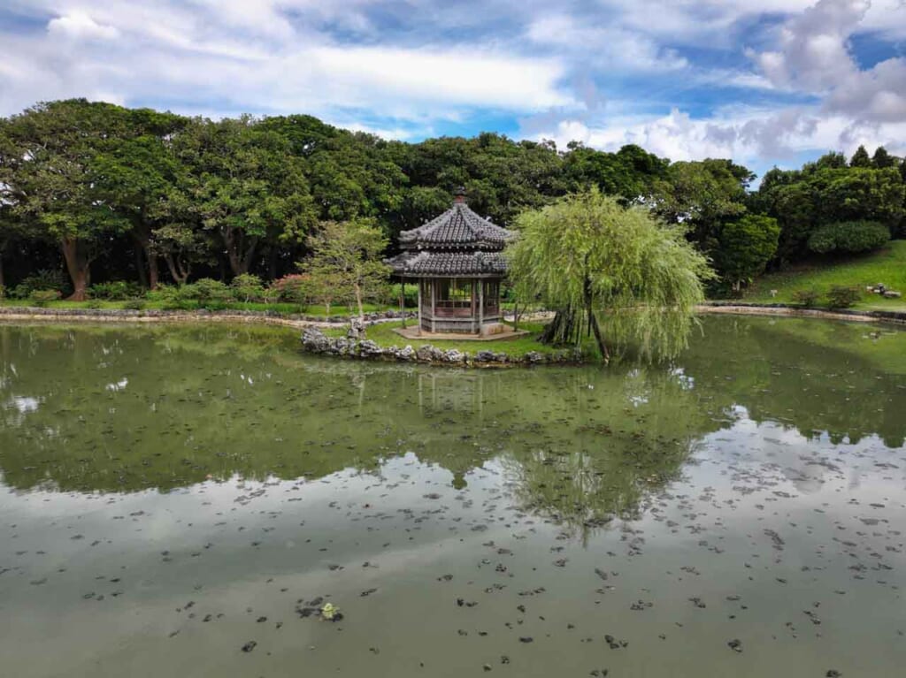 Chinese style pagoda in nmiddle of a pond in  Okinawa garden, japan