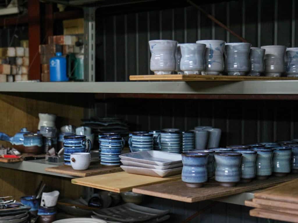 blue glazed tea cups and plates