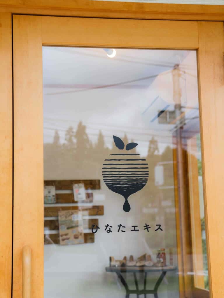 the logo on the glass door of Hinata Ekis smoothie shop
