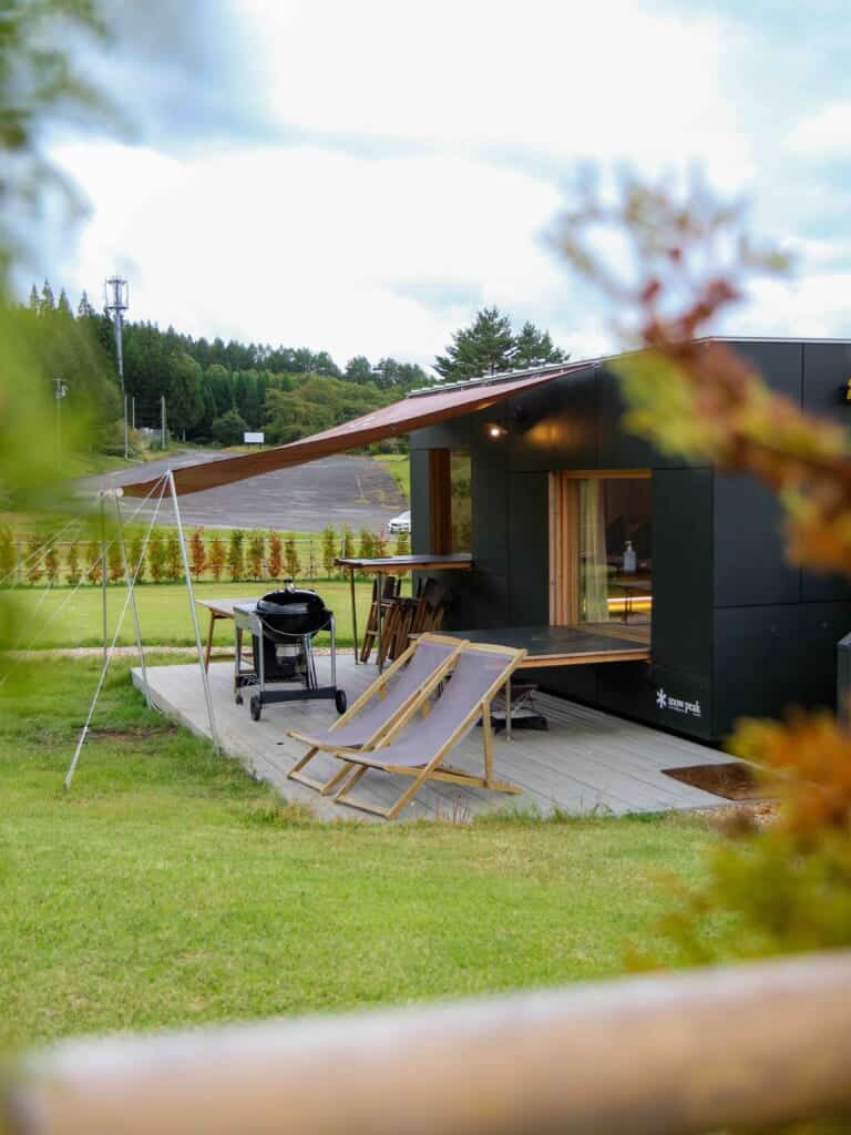 feature of the glamping room's exterior with the BBQ and lounge chairs