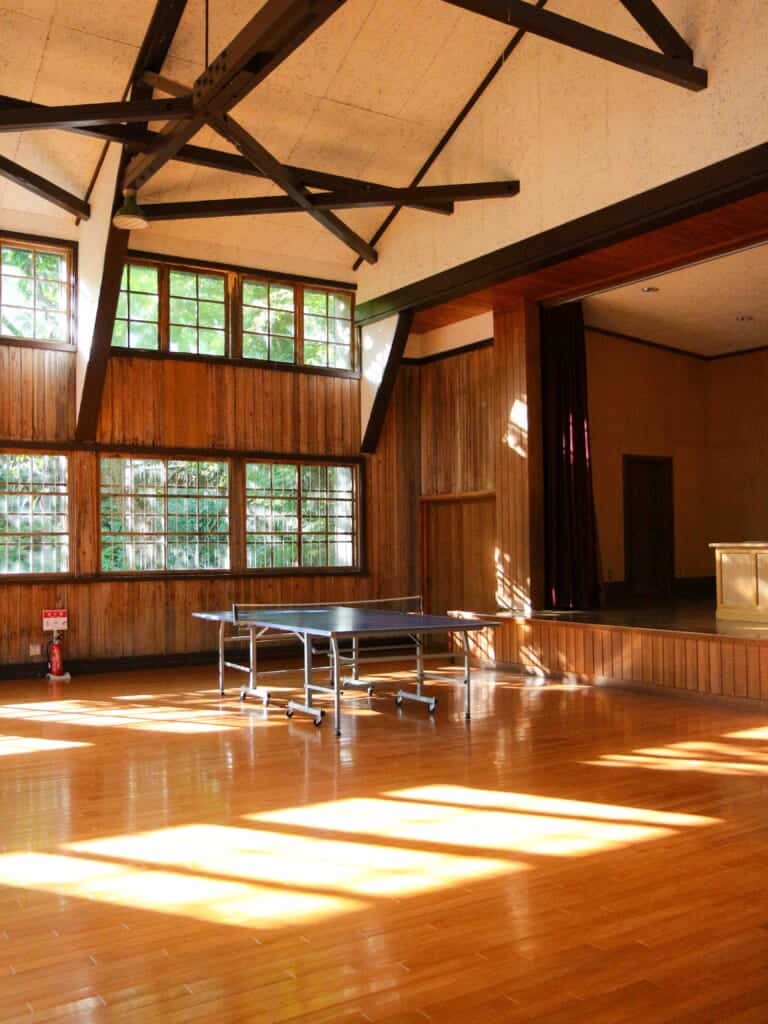 inside of the gymnasium with a table tennis table 