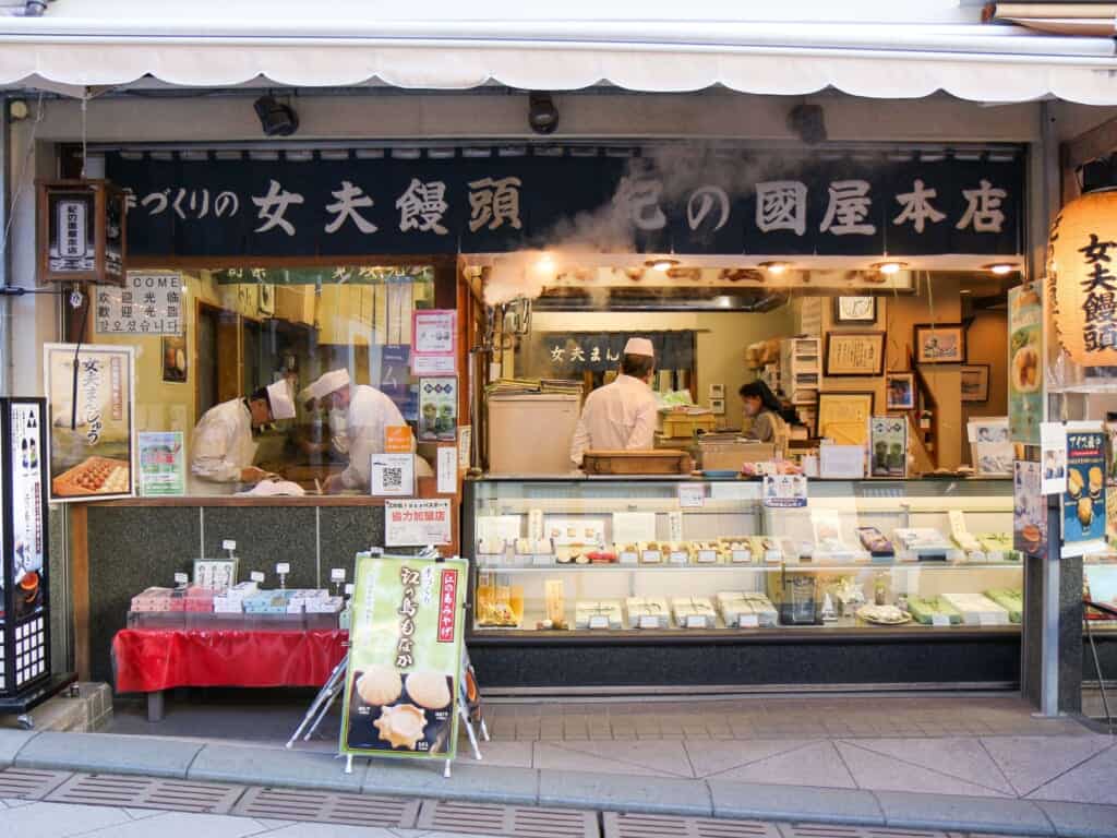 people working in traditional Japanese sweets hops in Enoshima