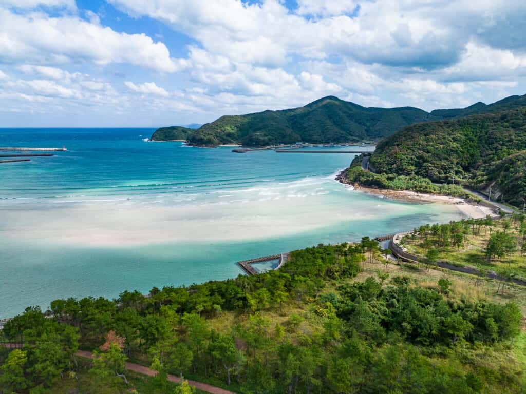 blue ocean coastline with green mountains during daytime in Nagasaki, Goto islands