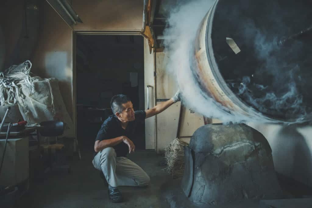 man using a mashine for producing patterened leather