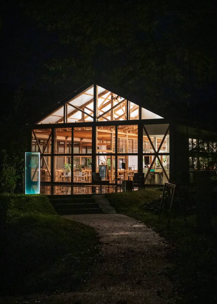 wood frame building at night with light inside, Japan
