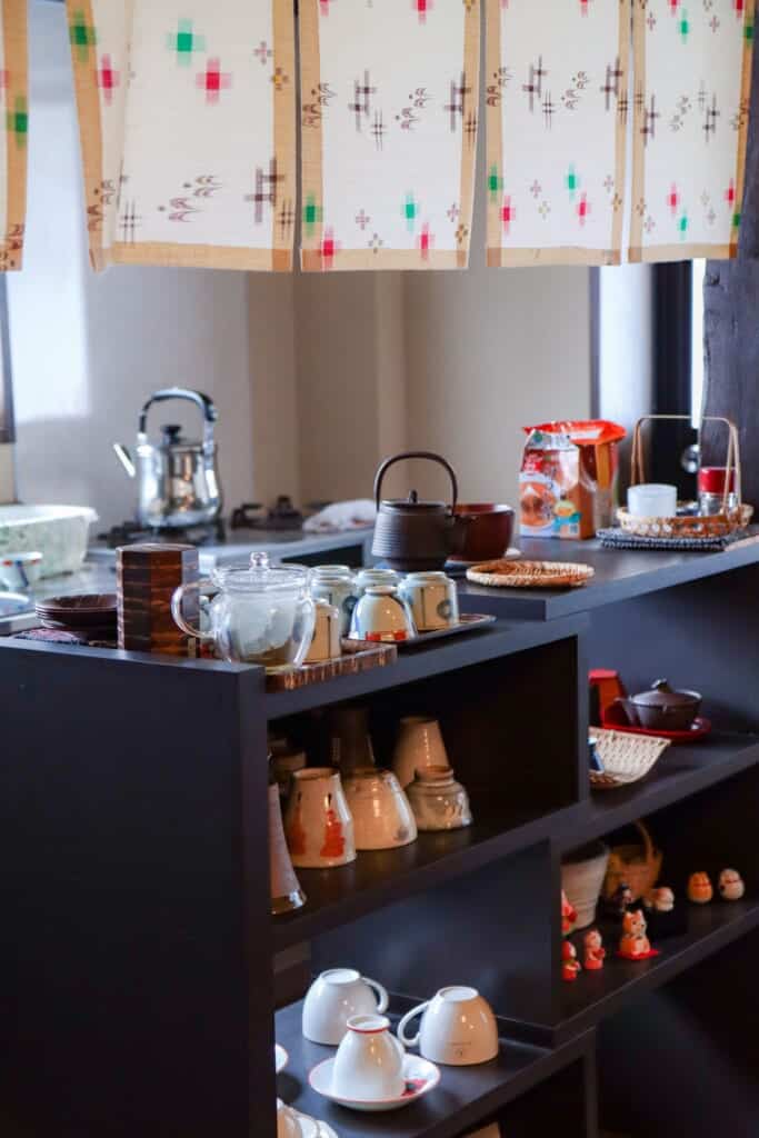 kitchen area of farm house with lots of tea pots and cups