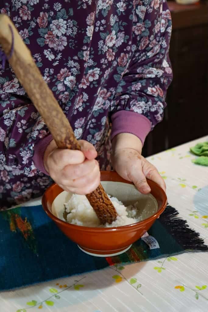 Mashing rice to make rice dumplings  in Semboku, Akita, Japan