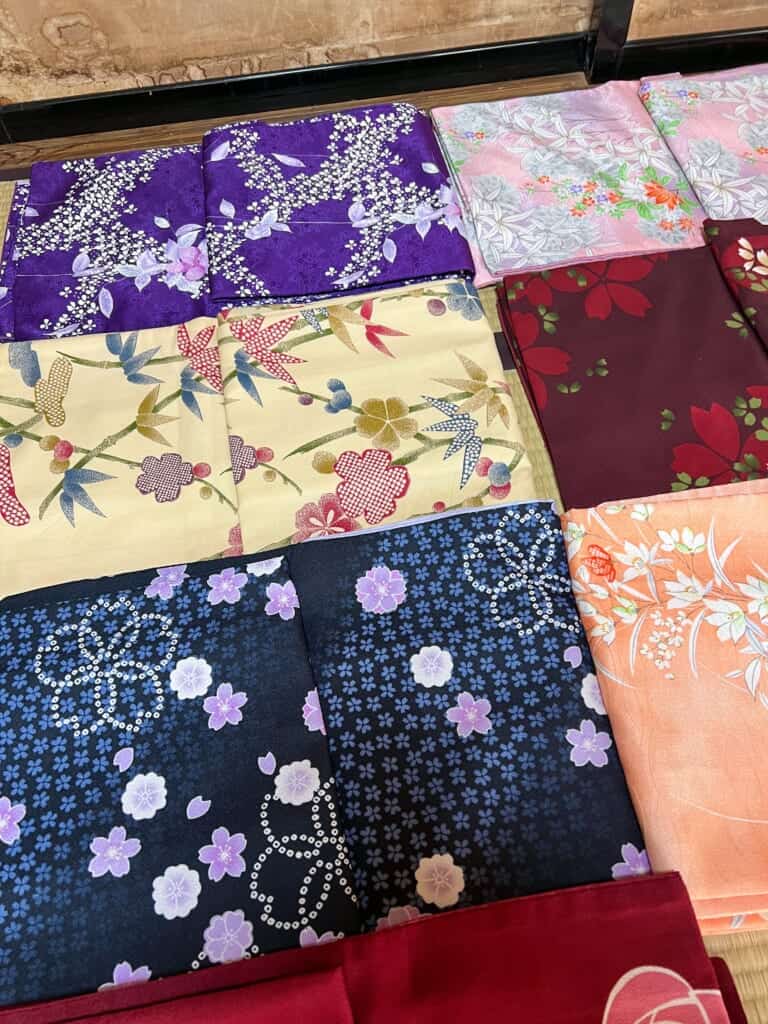 a selection of kimonos in purple, yuellow, pink, red and orange in JApan