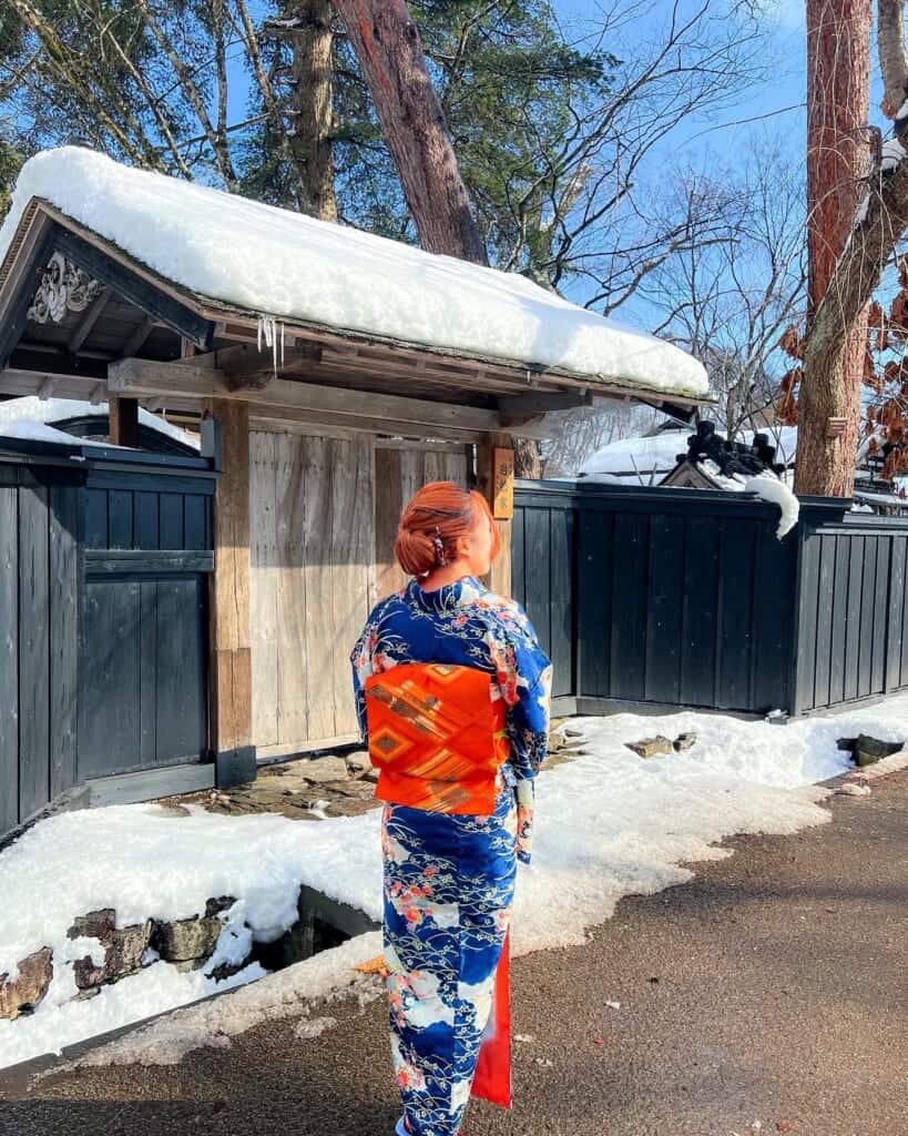 girl wearing a kimono while walking in historical samurai district in Kakunodate, Akita, Japan