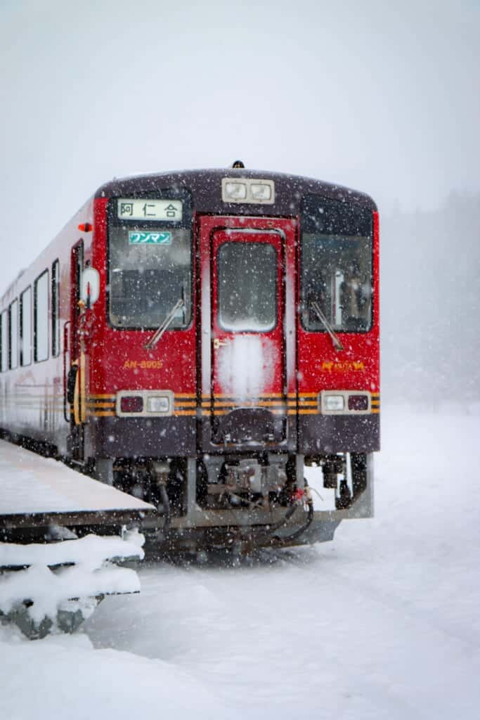 Red train in the snow from the Akita Nairiku Railway