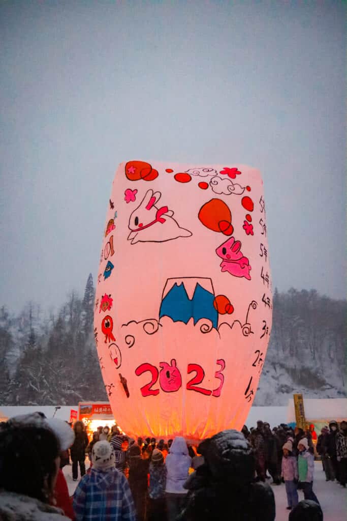 large paper balloon with a paintings by little kids of rabbits and mount fuji
