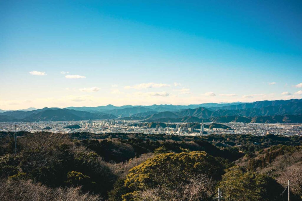 distant mountain landscape with modern city in the foreground in Shizuoka city, Japan
