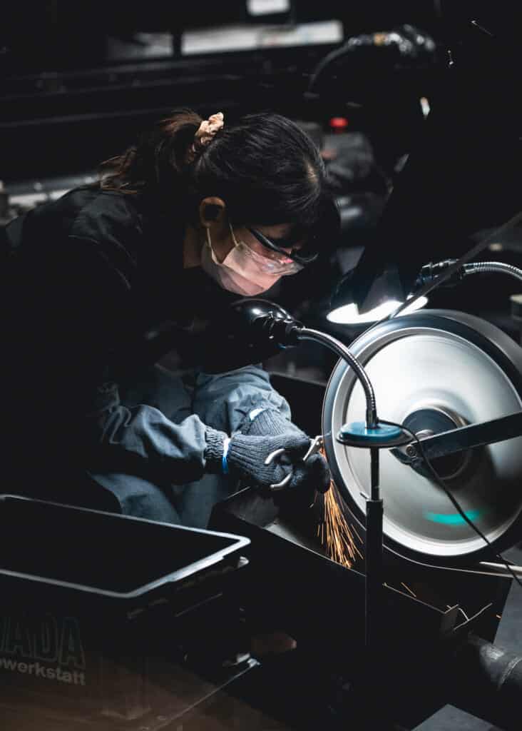 Japanese woman making tools in a metal workshop in Niigata, Japan