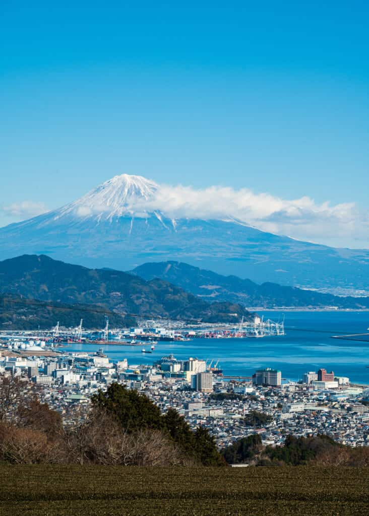 mt fuji views with port city in the foreground in Shizuoka city, Japan