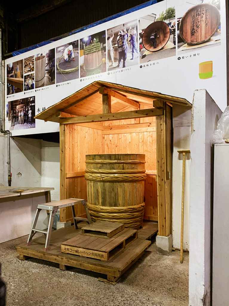 display of  a large wood vat used for soy sauce production in japan