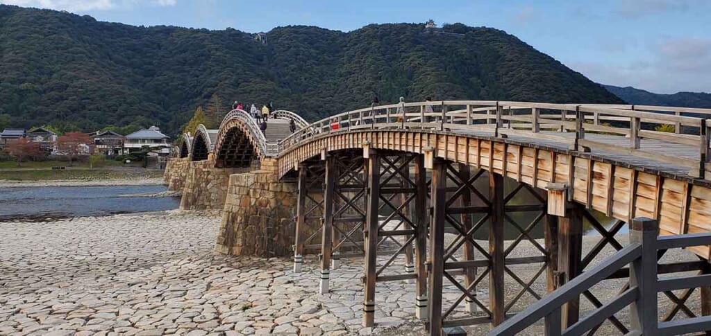 A view of Kintai Bridge, a traditional  Japanese bridge popular with tourists