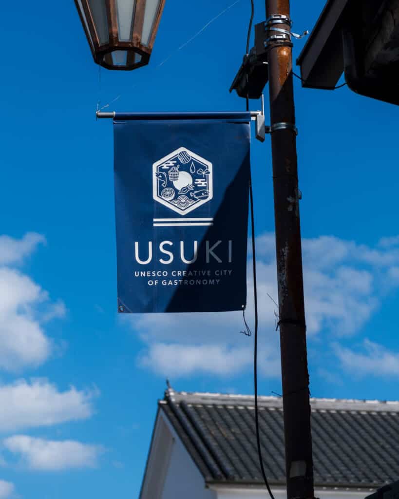 blue banner with the words Usuki UNESCO Creative city of gastronomy