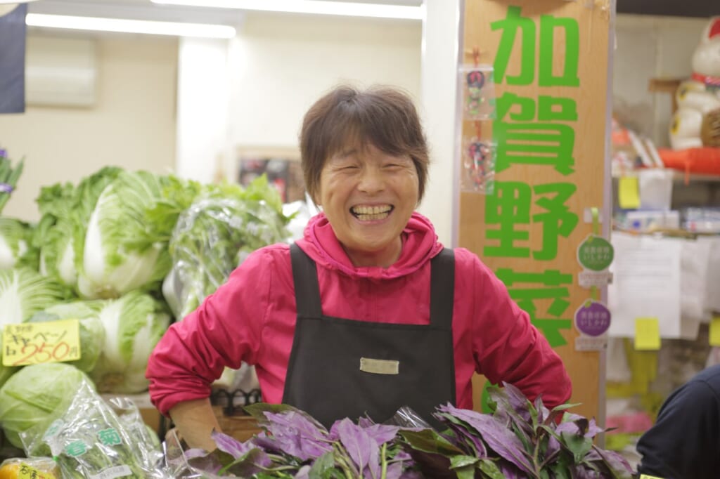 Smiling older lady at Omicho Market in Ishikawa