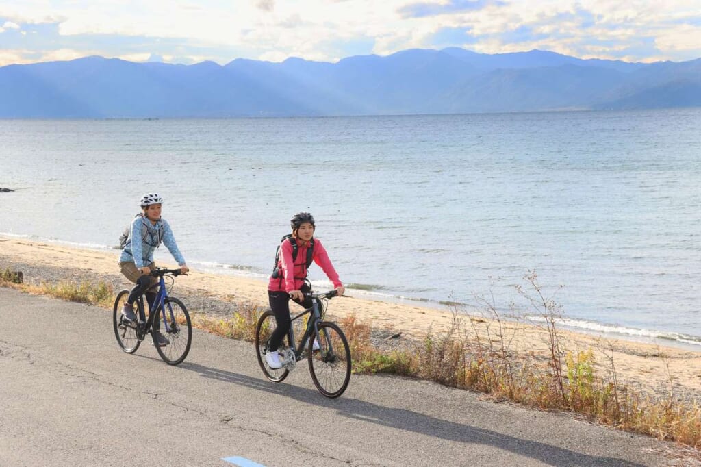 Two cyclists at Lake Biwa