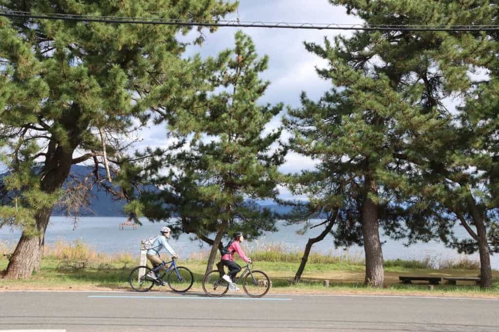 Two cyclists at Lake Biwa