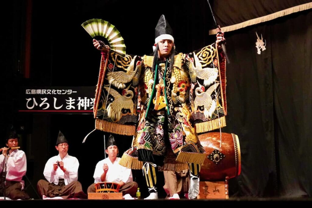 lavishly dressed performer in kagura dance