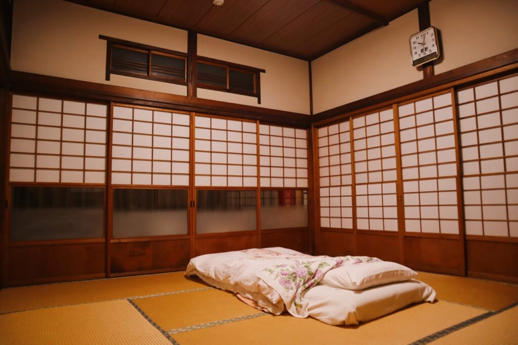 futon laid out in traditional Japanese-style room