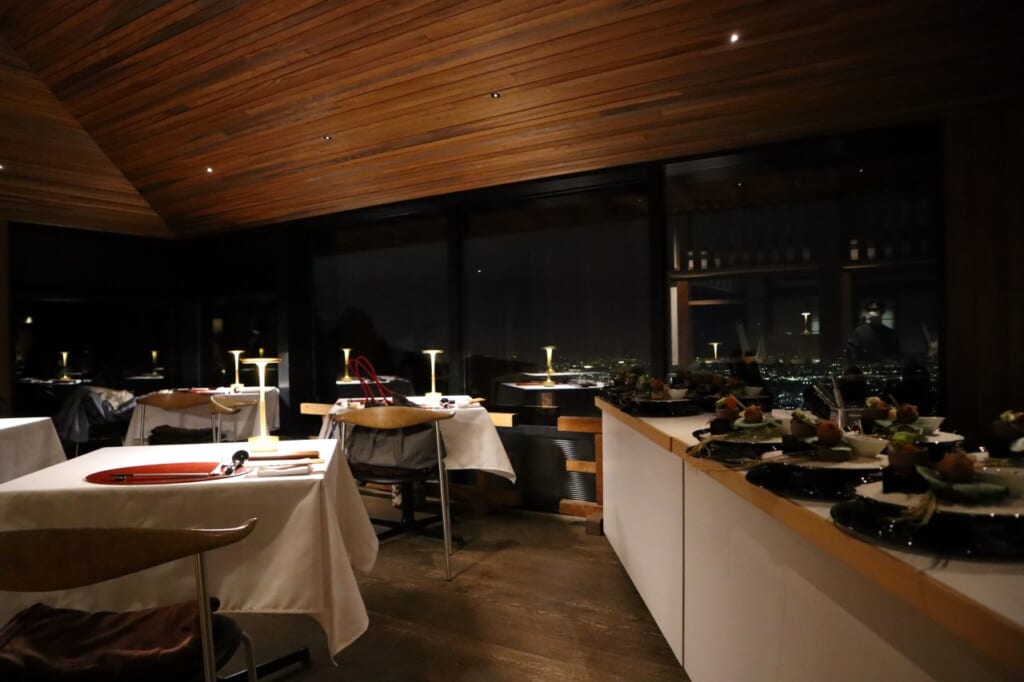 inside of restaurant with panoramic windows at night