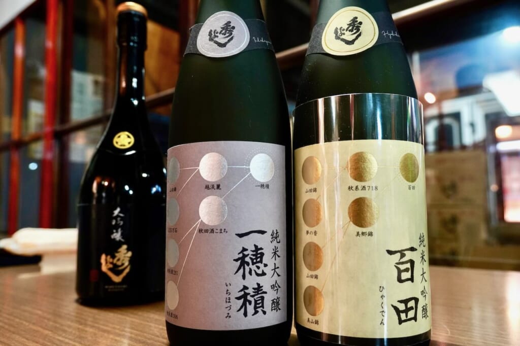 bottles of Hideyoshi Ichihozumi and Hyakuden sakes by Suzuki Sake Brewery in Akita