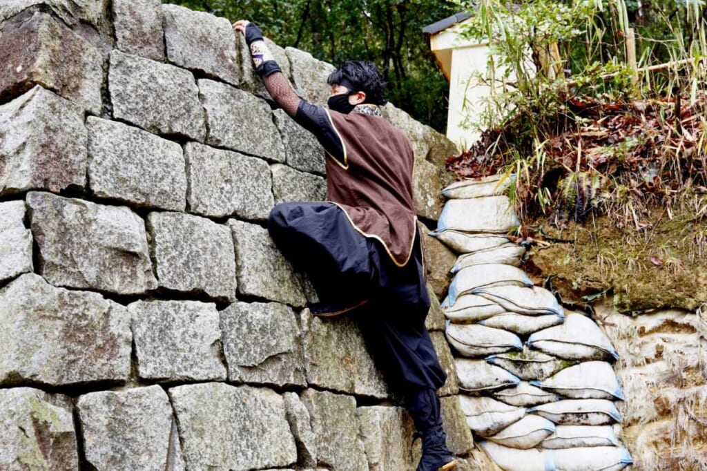 Ninja staff climbing a wall at Koka Ninja Village in Japan