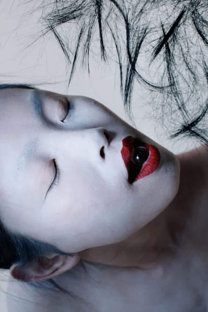 Butoh dancer face with red lipstick