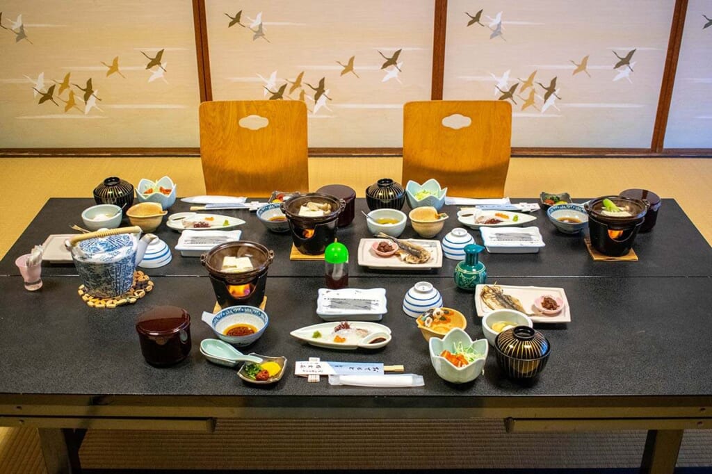 traditional Japanese meal set on table within a ryokan inn in Japan
