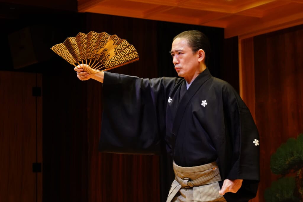 A man with a golden fan