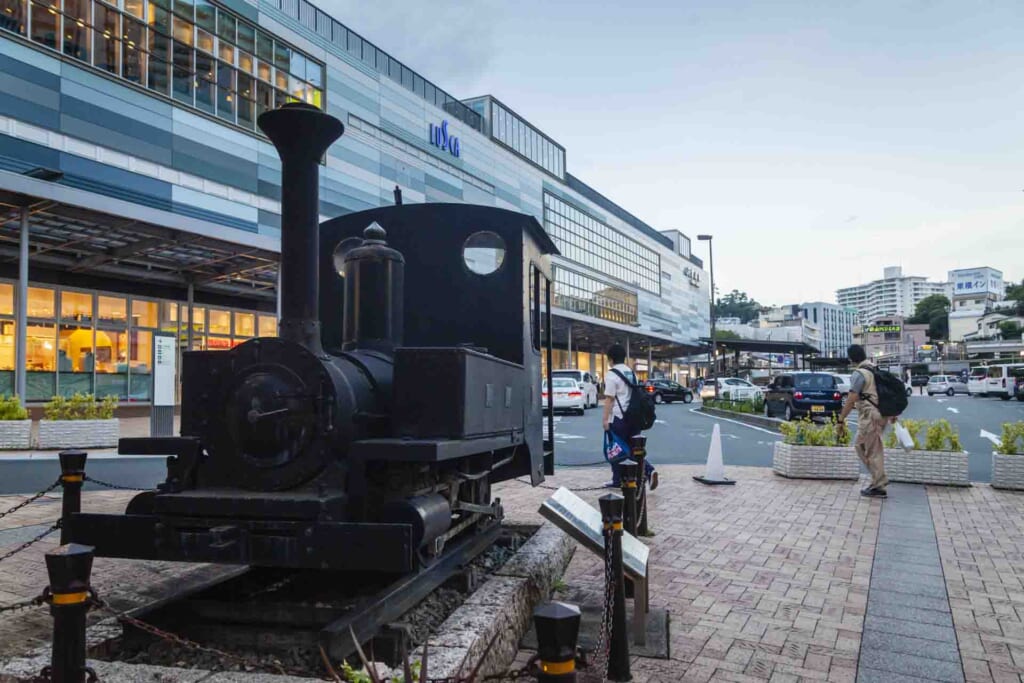 Steam Locomotive facing the shotengai, Station building behind it