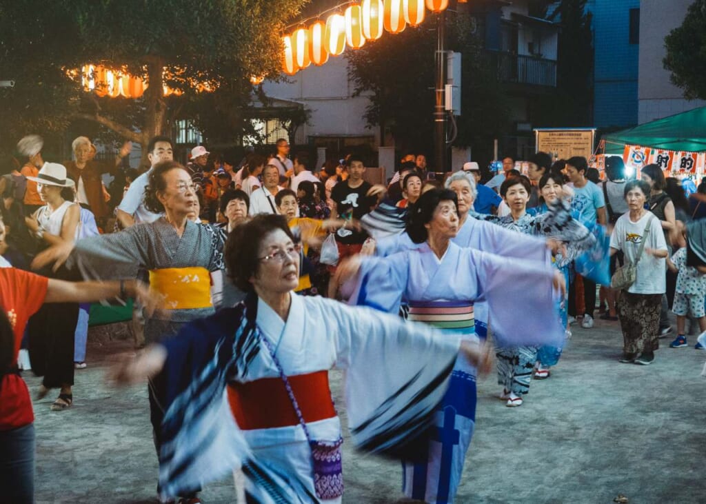 females dressed up in yukatas, dancing bon odori