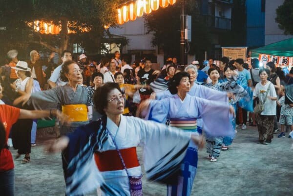 females dressed up in yukatas, dancing bon odori