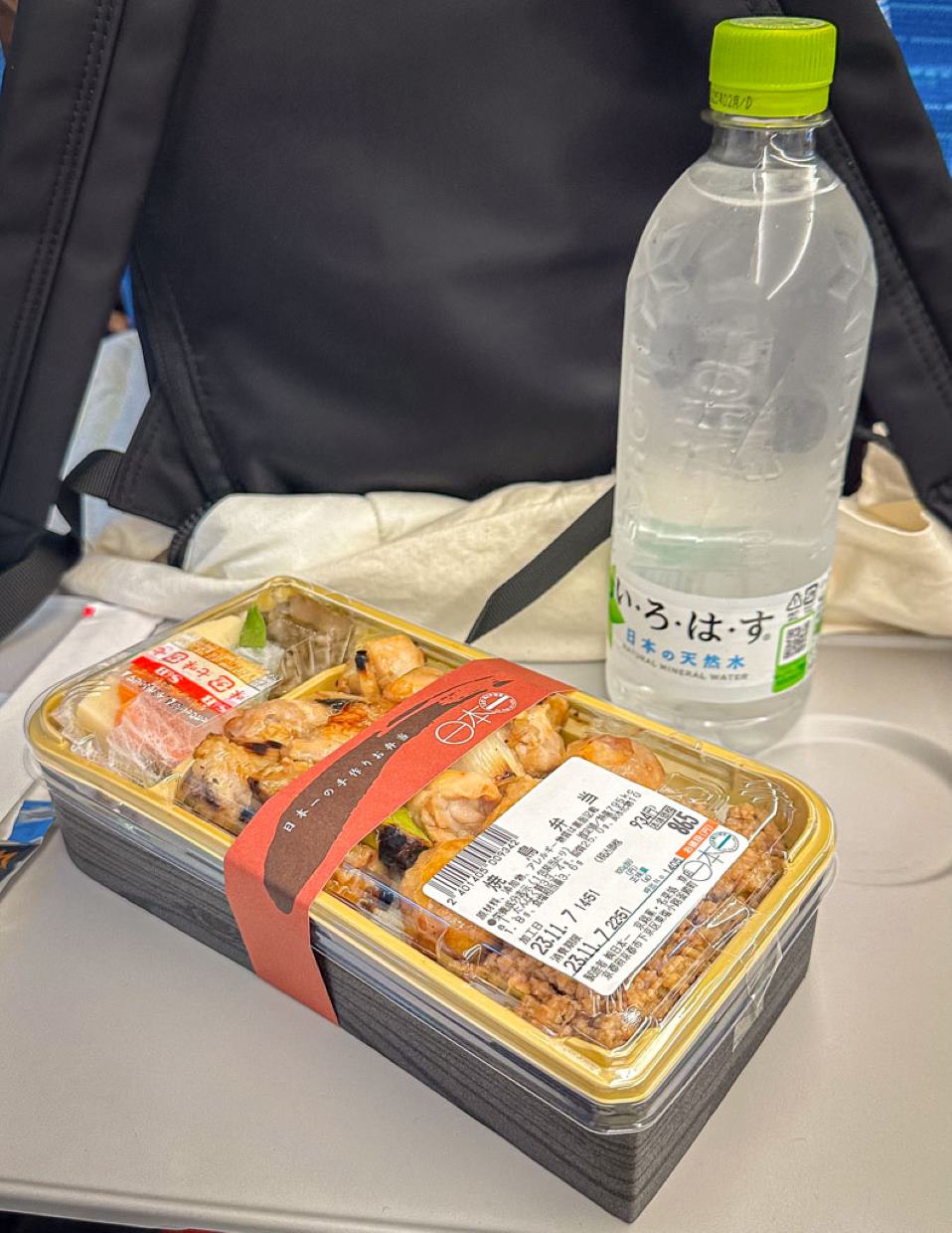 A train bullet bento with a bottle of water