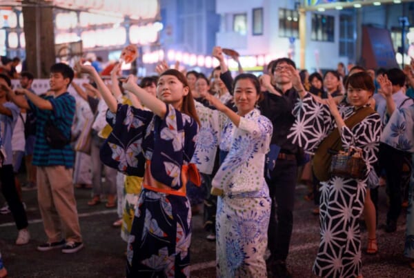 Females dressed in yukata, joining bon odori