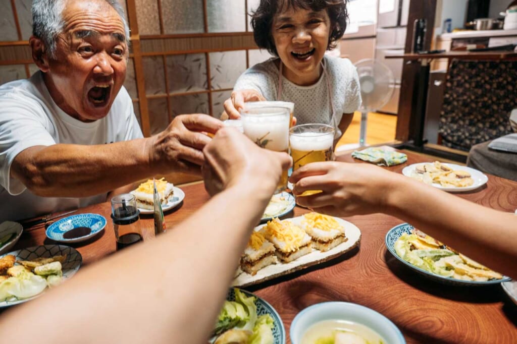 toasting with beer with japanese family in ojika nagasaki