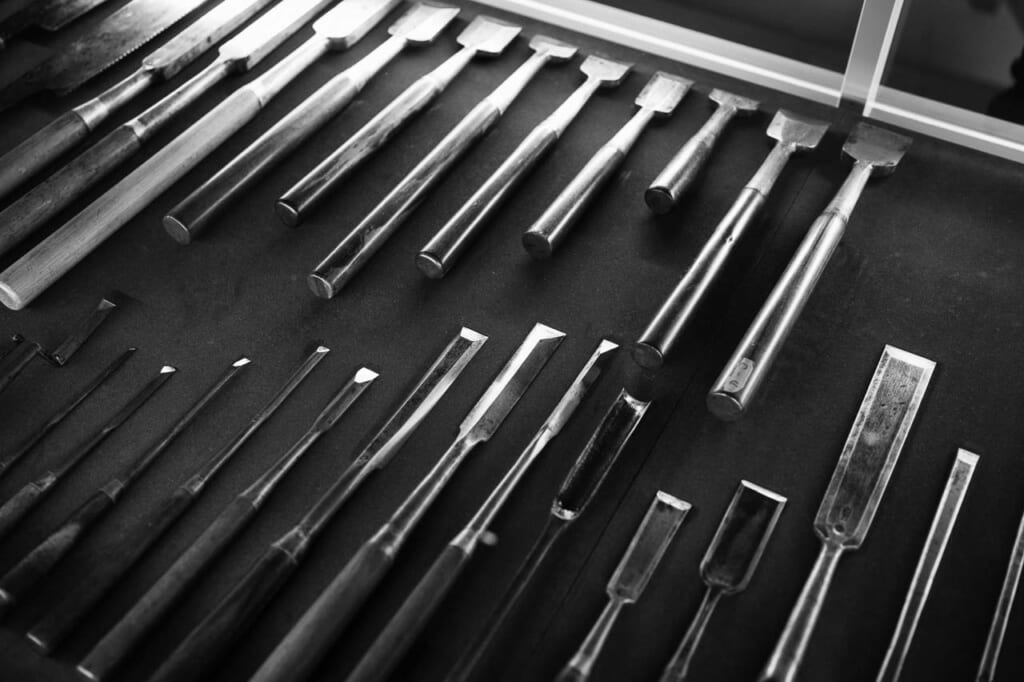 various types of chisels used in Japanese traditional construction on display at Takenaka Carpentry Tools Museum in Kobe Japan