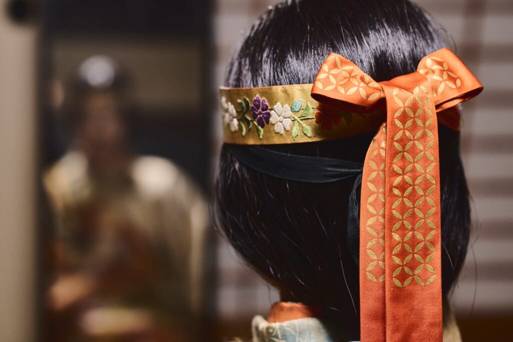 person with a traditional noh wig